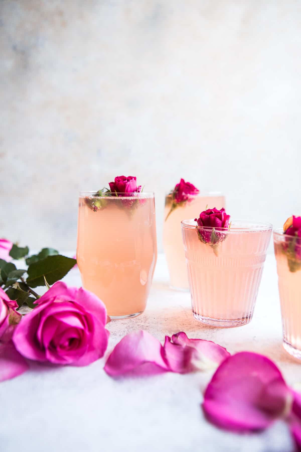 4 springtime cocktails with pink roses.