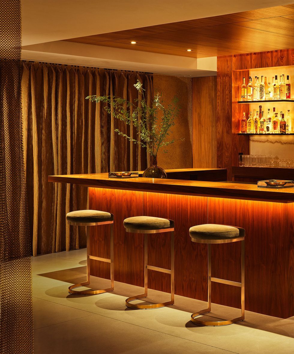 Home bar with oragne moody lighting.